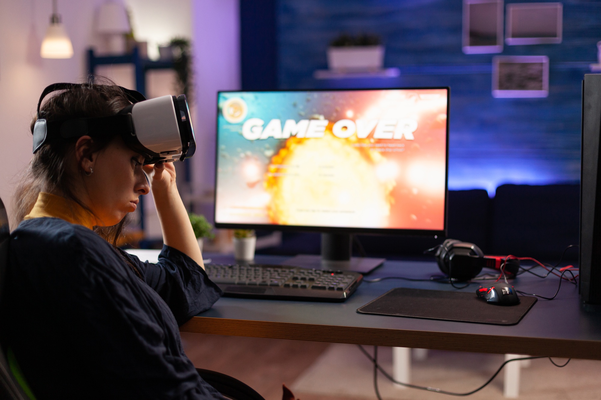 Gamer using vr goggles to play video games